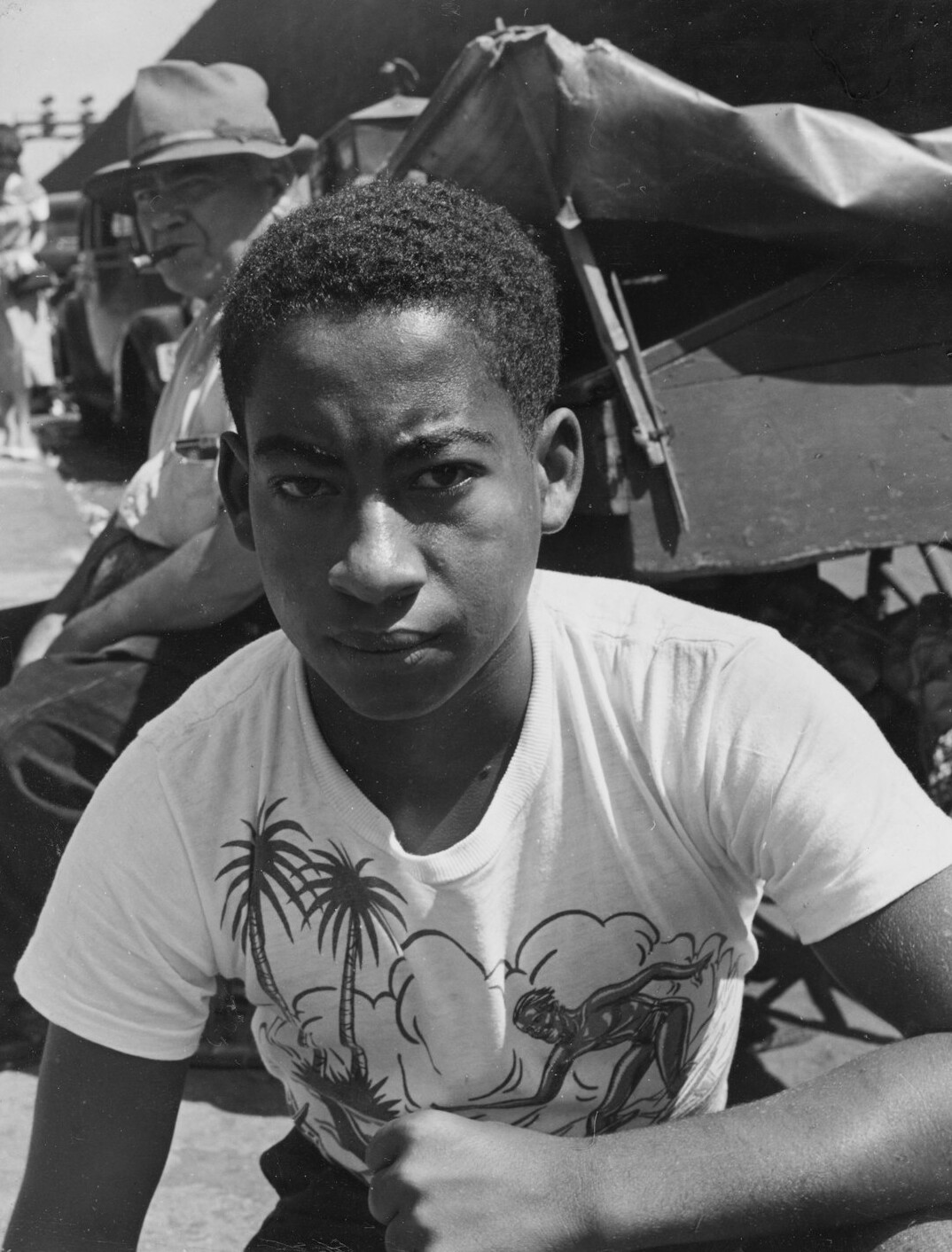 Portrait of a young man with short hair wearing a shirt