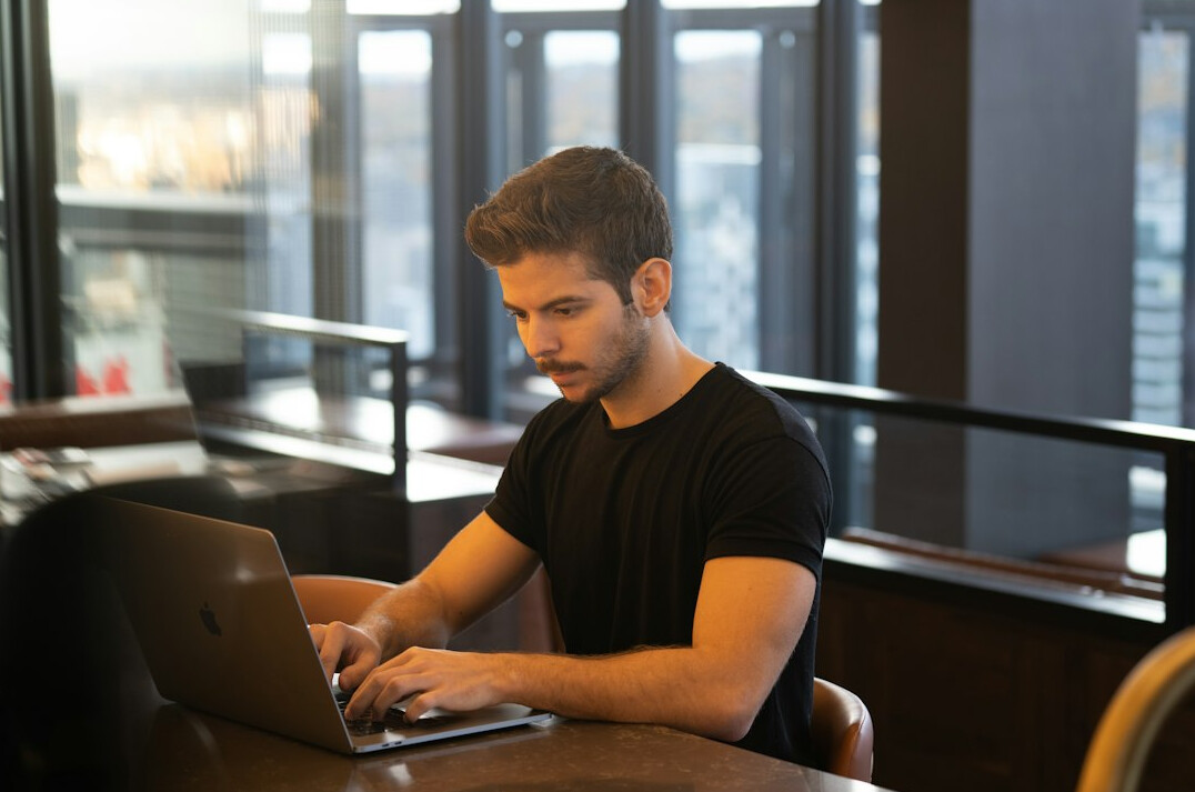 programmer working on laptop