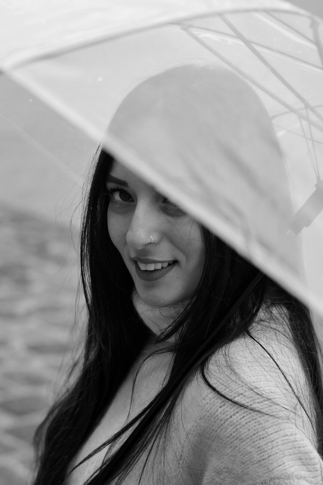 Portrait of a young woman with dark hair smiling
